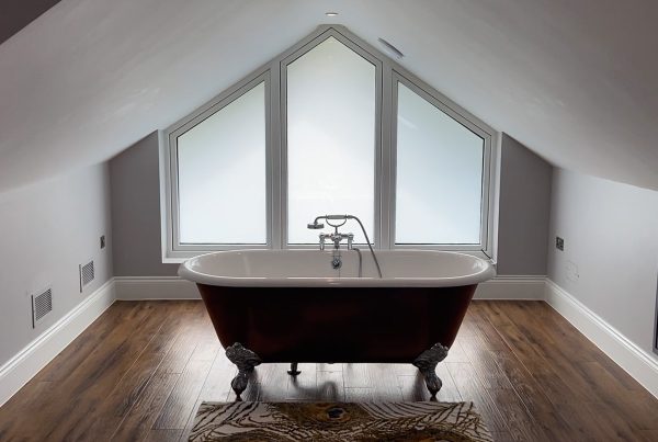 Roll top bath at large double glazed window with switchable film retrofitted - off