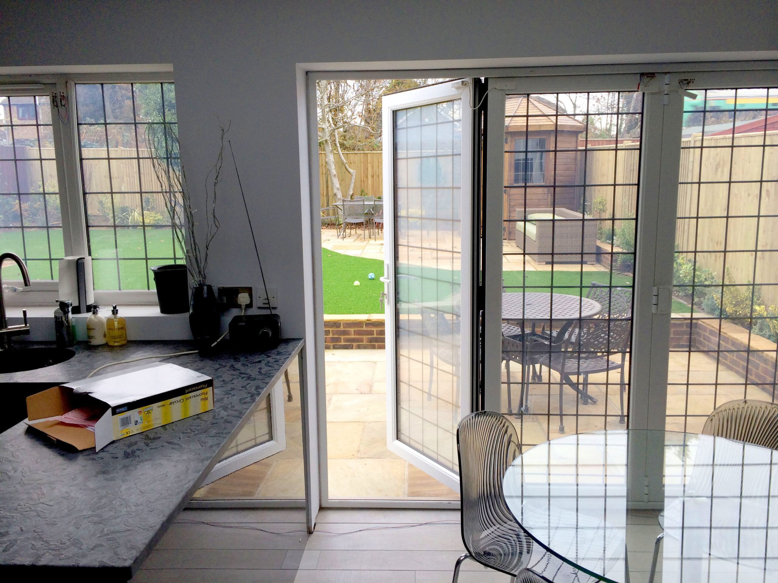 Double Glazed Smart Glass BiFold Doors in a kitchen switched to on